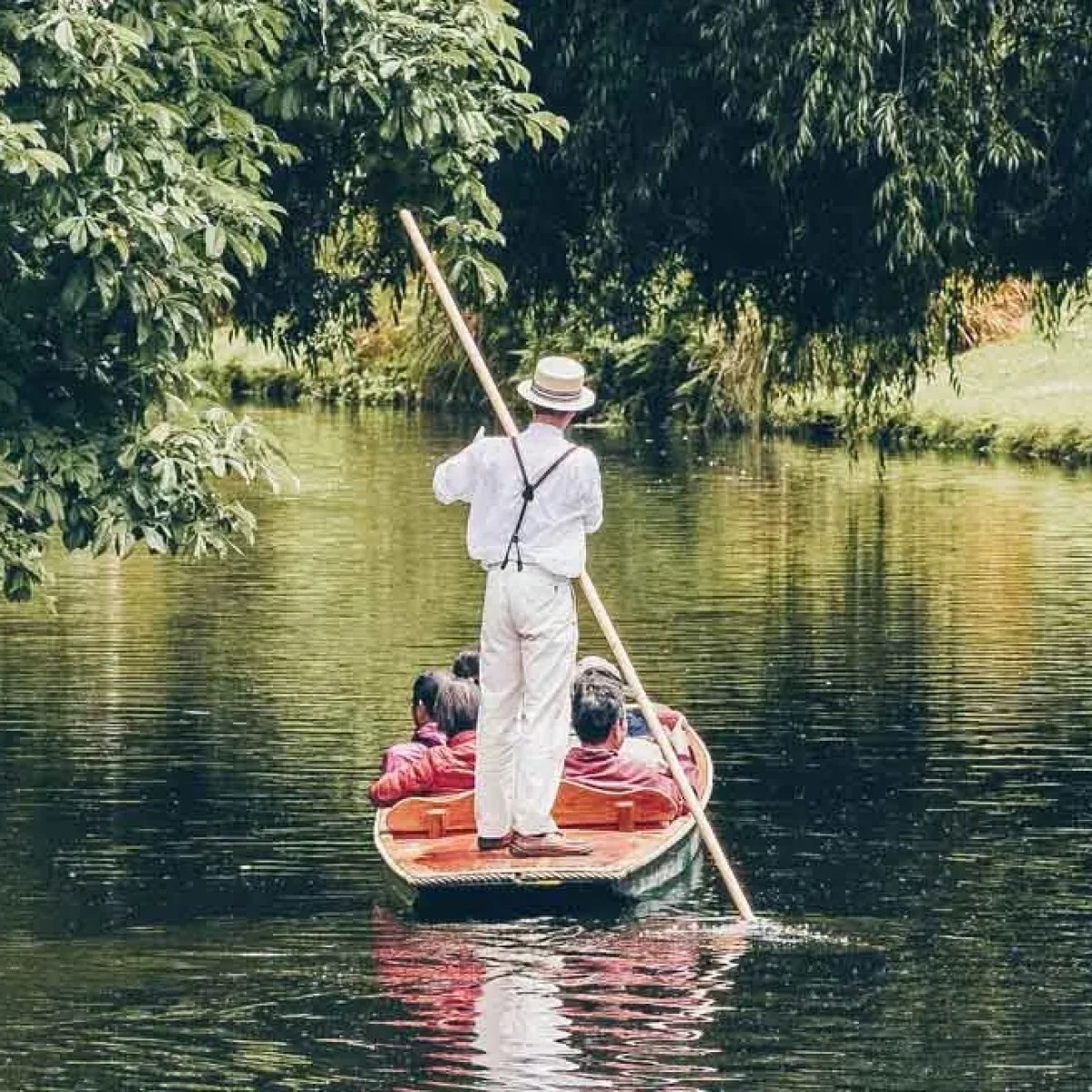 a group of people riding a punt