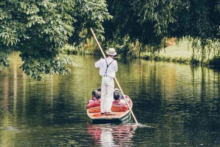 a group of people riding a punt
