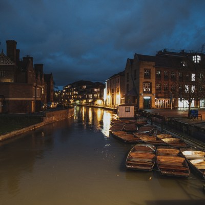 a view of a city at night near a canal